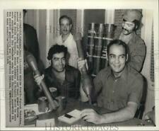 1975 Press Photo Moslem Fighter Farouk Moukaddem shows rockets in Tripoli