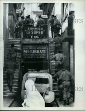 1962 Press Photo Moslem Woman Watches as French Security Forces Move Thru Casbah